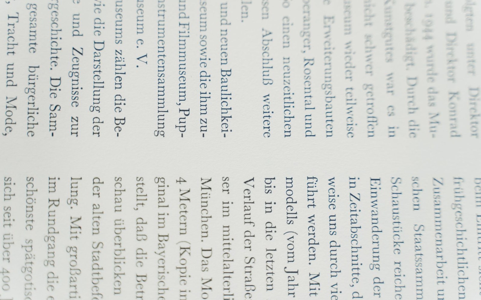 Close-up of a page of German text printed vertically across a book's columns