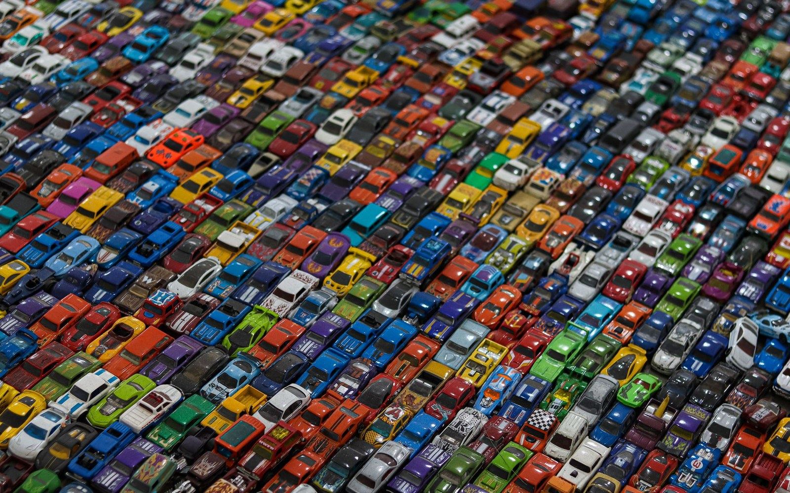 A row of Matchbox 1-75 series diecast vehicles arranged in their individual boxes on a plain surface, box art facing the camera